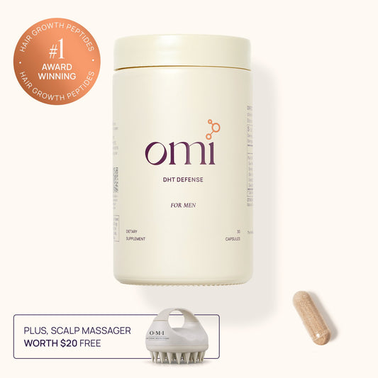 Omi DHT Defense supplement container with a scalp massager and capsule on a white background