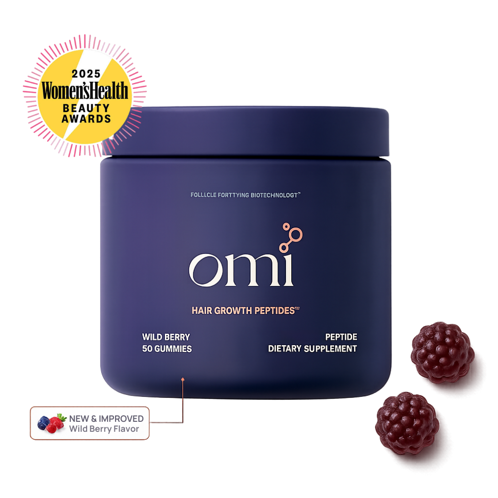 OMI Hair Growth Peptides Gummies – Wild Berry flavor, 50 gummies, Peptide Dietary Supplement featuring Follicle Fortifying Biotechnology™. New & Improved Wild Berry Flavor. Winner of the 2025 Women's Health Beauty Awards. Navy blue jar on a dark background with wild berry gummies floating alongside.